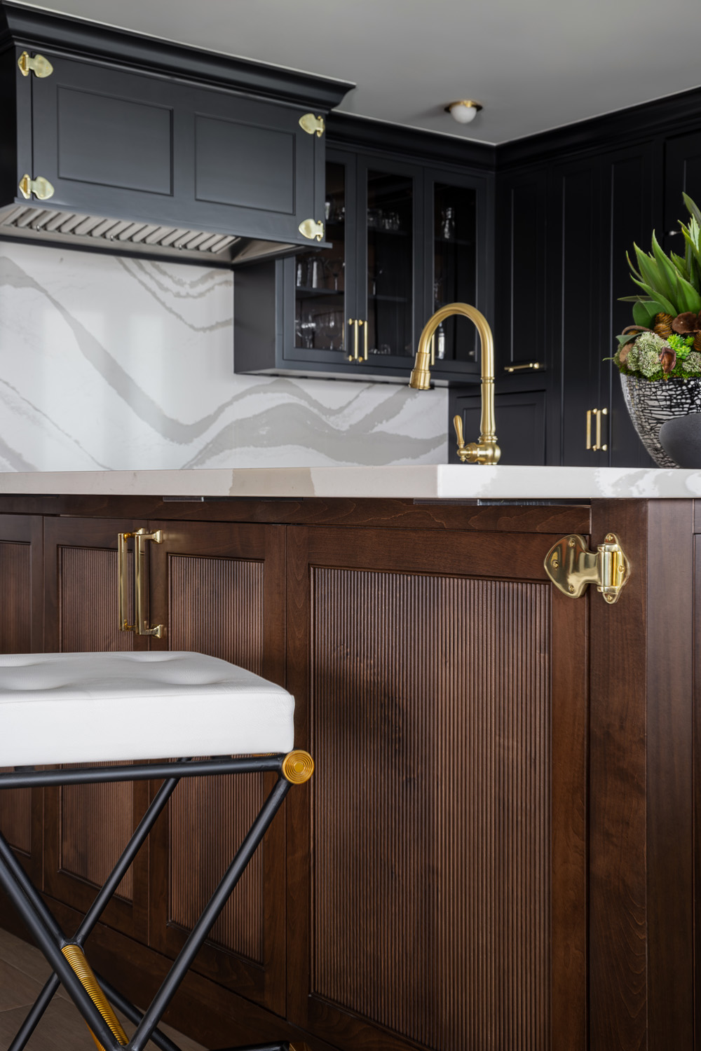 dark wooden cabinets and cambria slab