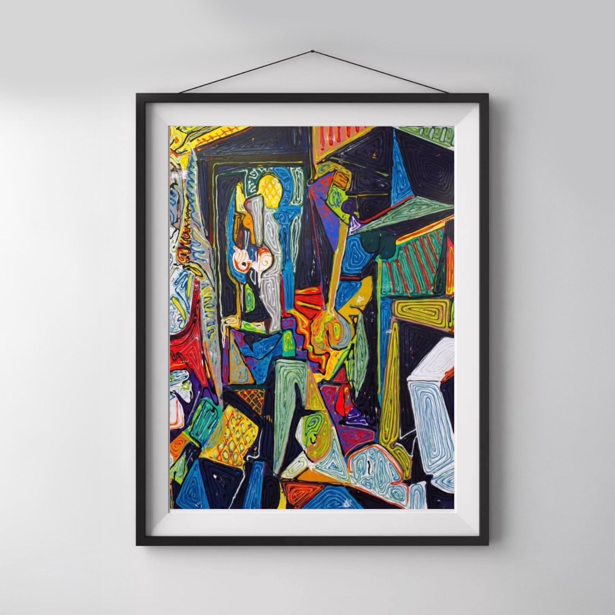 Framed abstract painting with vibrant, colorful geometric shapes and swirling lines, hanging on a white wall.