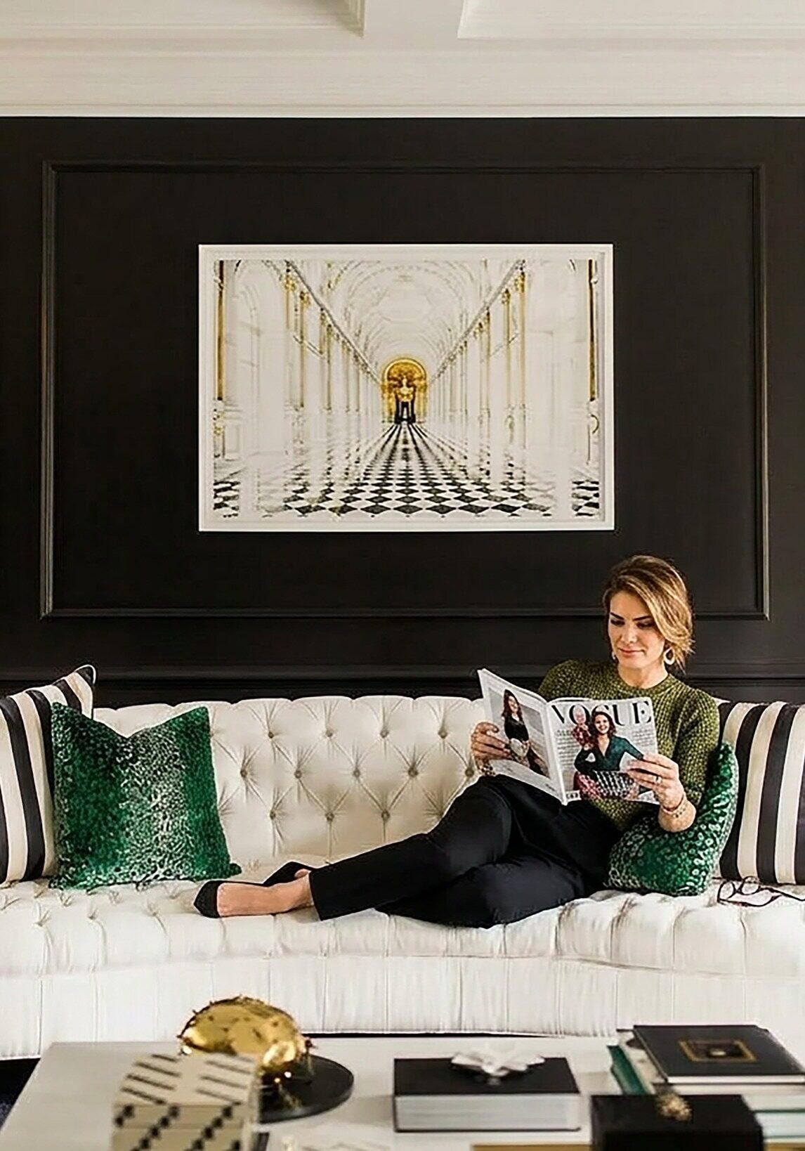 Modern luxury living room with velvet headboard and gold lighting